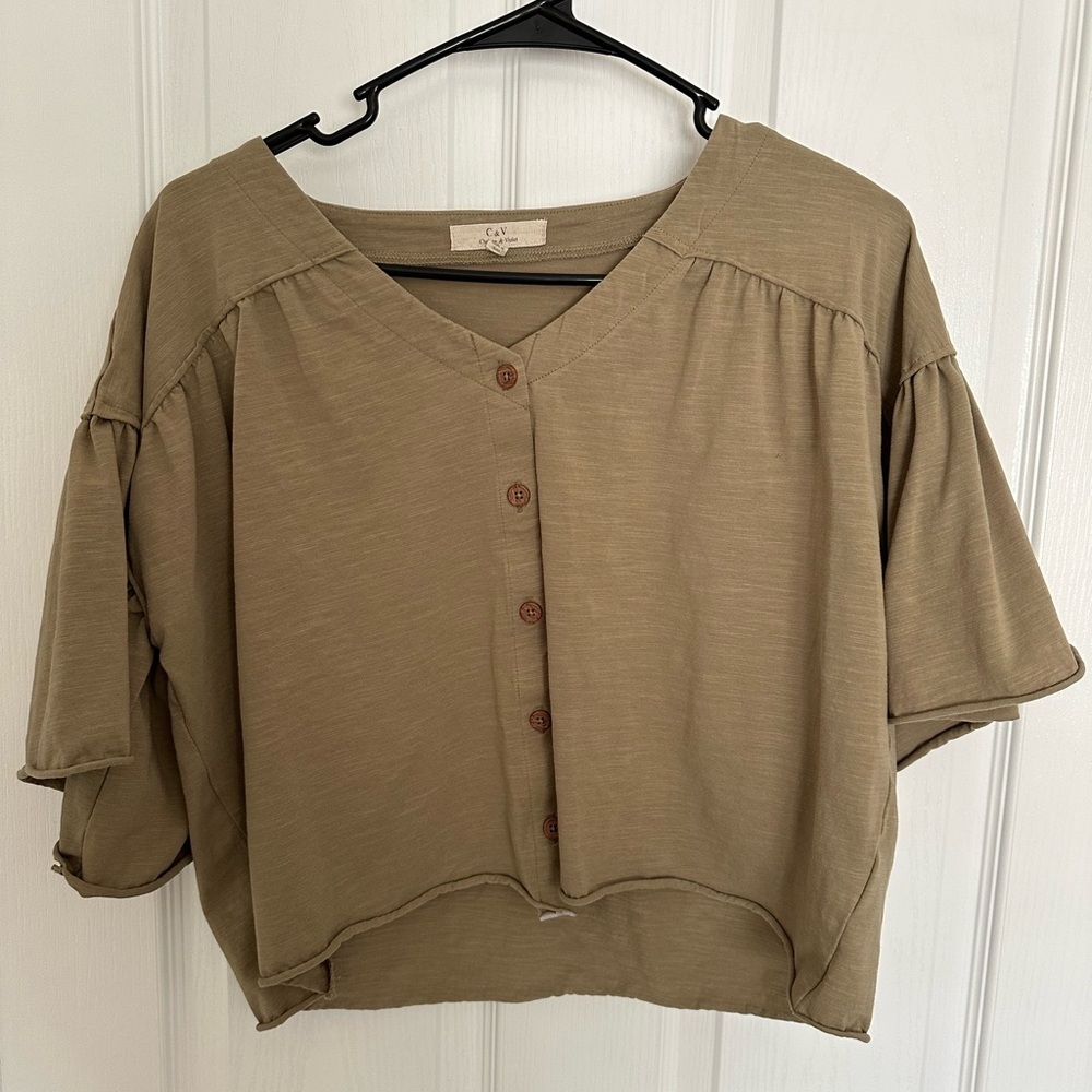 Green short sleeve top with ruffle puff sleeves and button down